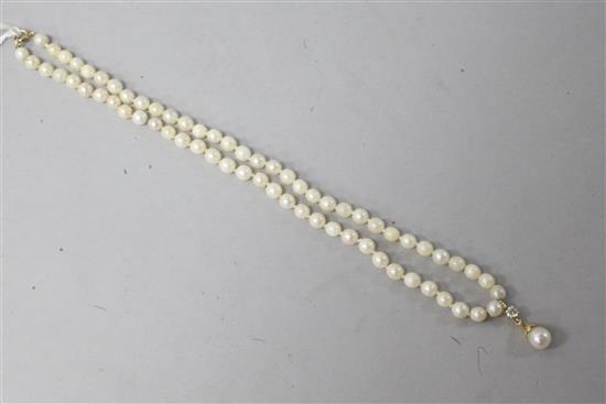 A single strand cultured pearl necklace with a cultured pearl and diamond set drop and 18ct gold clasp, 18in.